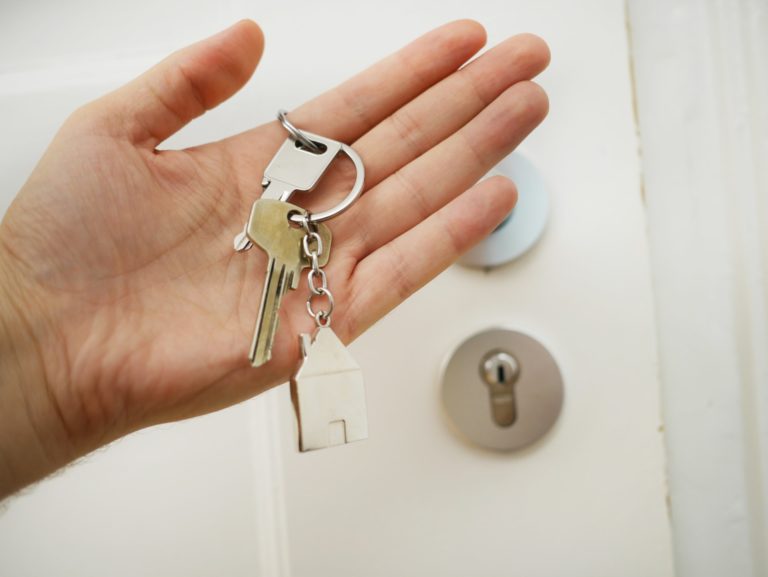 a hand holding a key