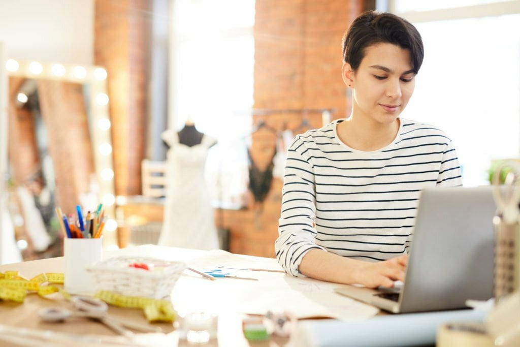 a woman working on a laptop
